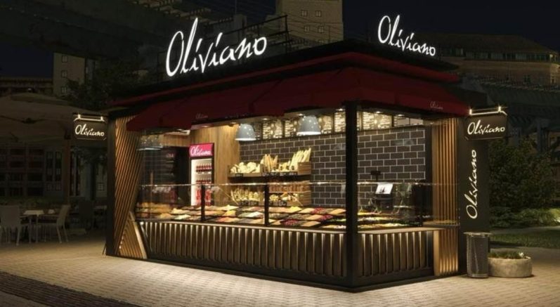 Modularer Restaurantcontainer Oliva Uno – Gastronomieeinheit mit Holzverkleidung, Überdachung und Kundenbereich im Außenraum